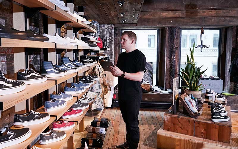 store associate taking inventory inside a retail store
